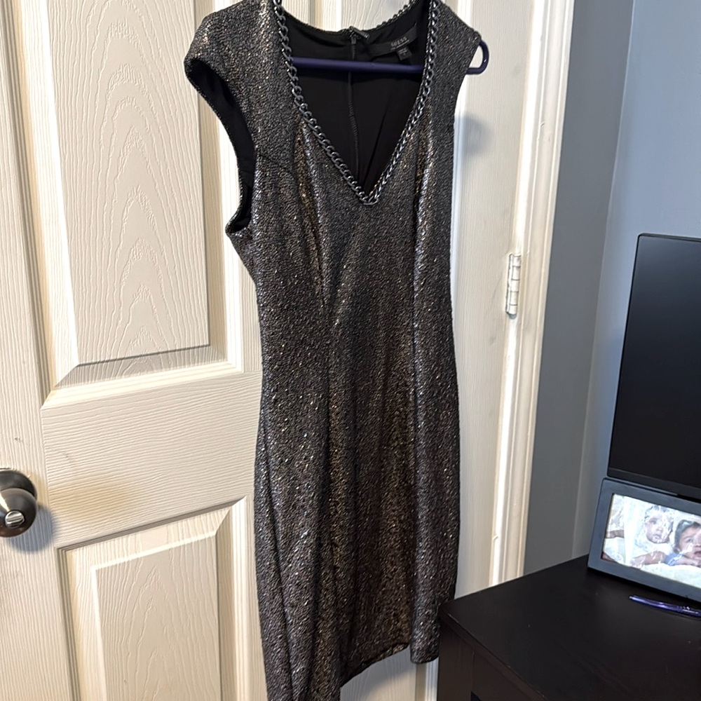 Guess Not used no tag size small silver mix with black color